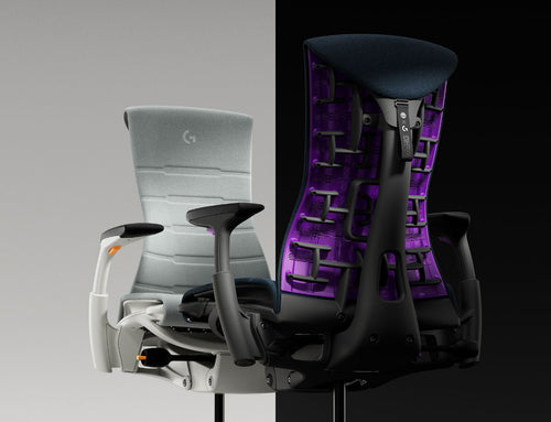 Deux fauteuils gaming Herman Miller Embody se faisant face, dans les couleurs orange gris Ignite et violet bleu Nova.