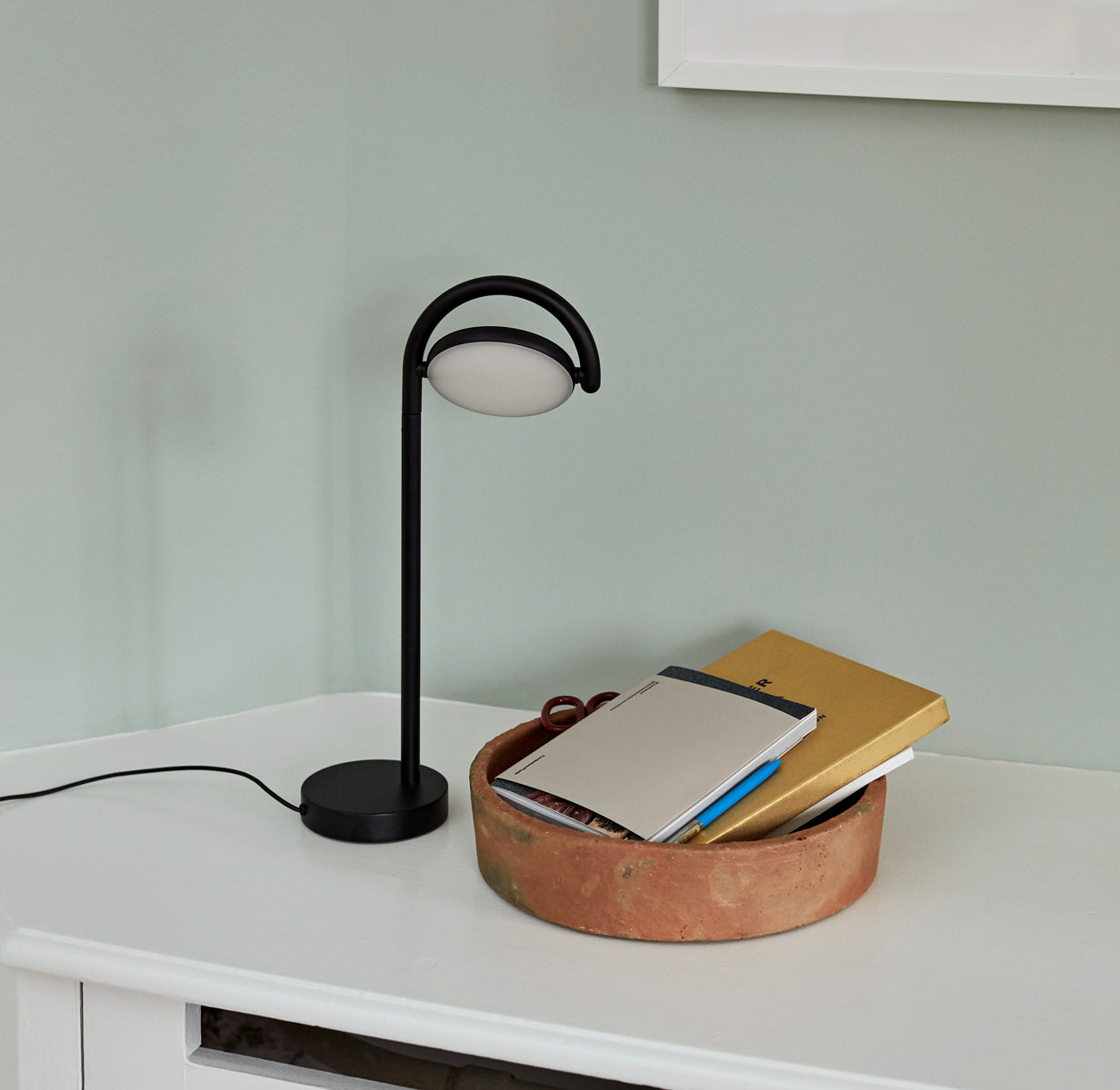 Hay Marselis desktop lamp in black on desk with some books