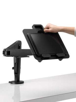 Close-up of seat adjustment controls on a mineral Aeron office chair