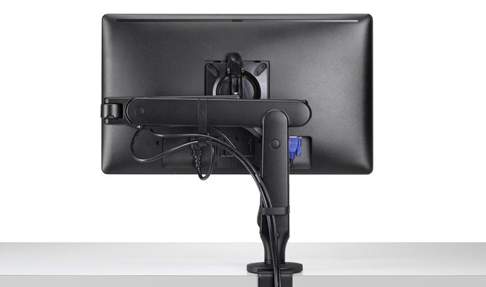 Vue arrière d'un bras de moniteur Ollin noir de CBS, montrant la gestion intégrée des câbles.