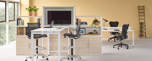 Two graphite Setu Stools at a high table